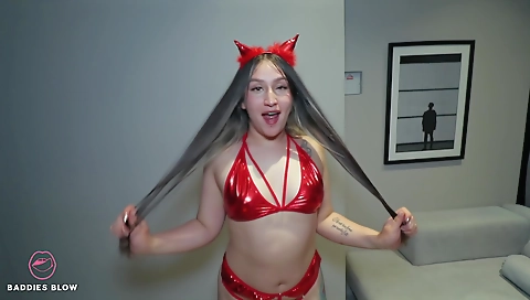 Latina with a tattoo shows her pussy to a large dildo