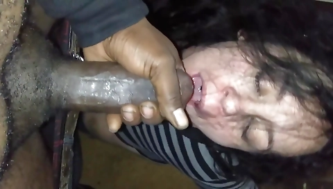 Brunette woman with natural tits swallows a black dick