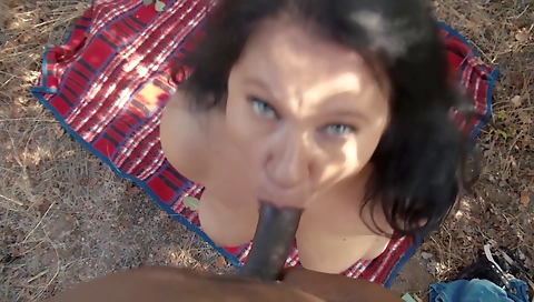 Busty brunette milf with a big ass giving a blowjob