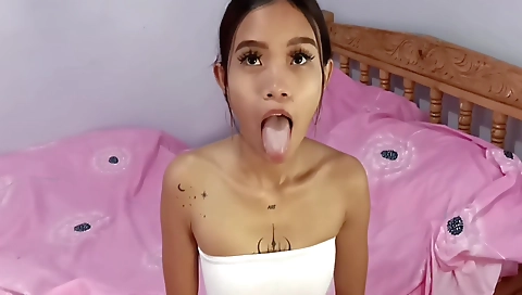 Asian tattooed teen gets a blowjob from a white dude