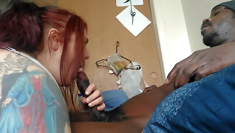 Busty redhead fucks a black dude with a cock in the bed