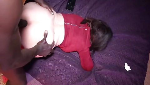 Amateur brunette is giving a blowjob to a big cock